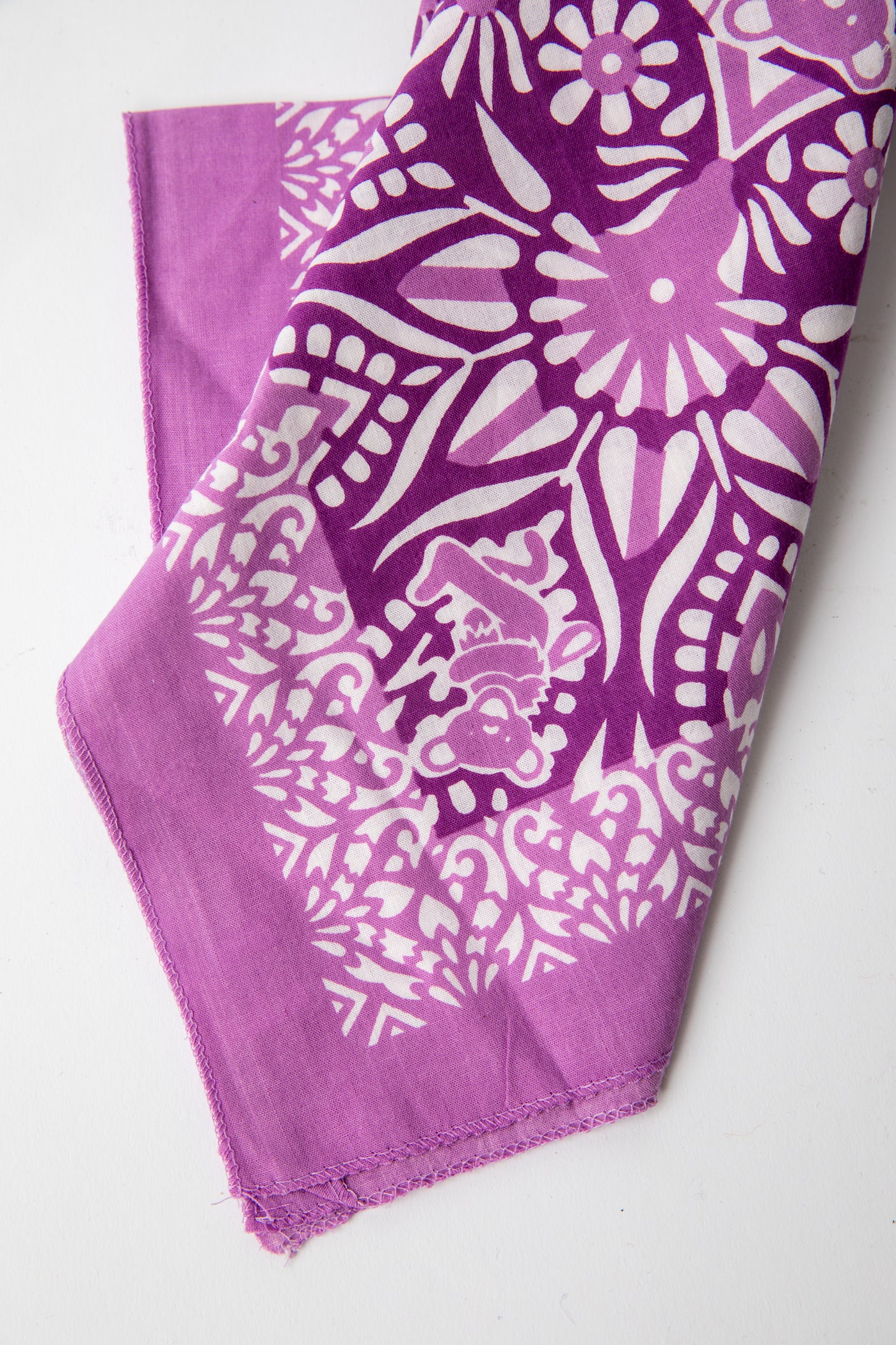 Folded purple Grateful Dead bandana highlighting intricate mandala details and Dancing Bears motif