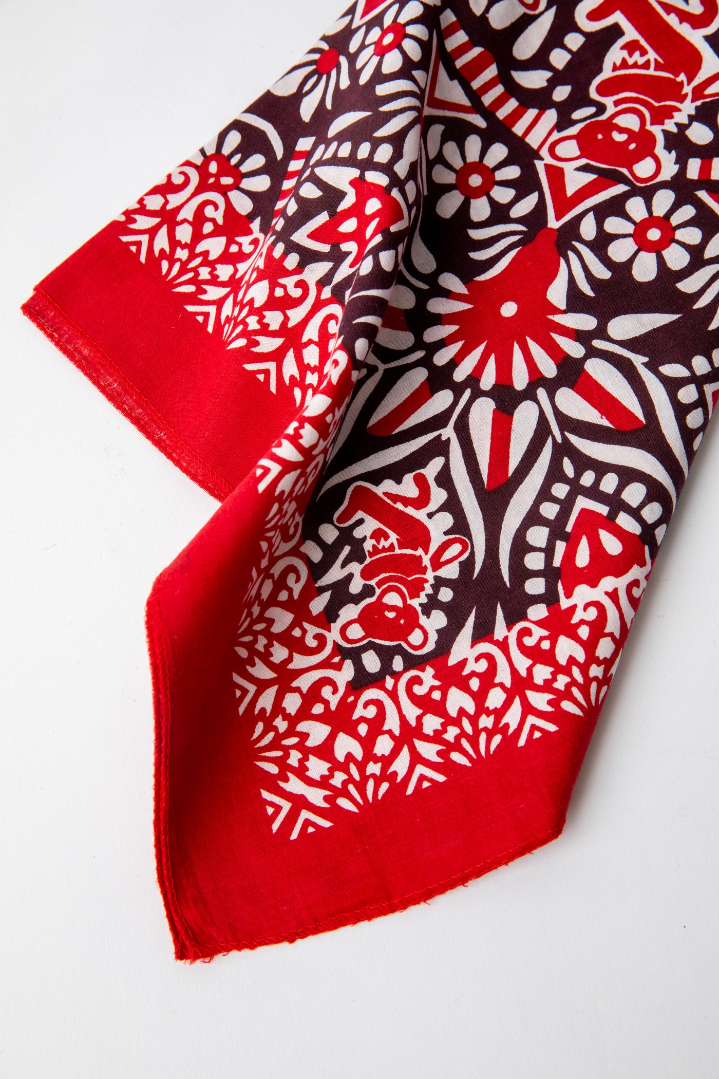 Folded red Mandala Bears Grateful Dead Bandana with bold white Dancing Bears and mandala pattern on deep red cotton fabric