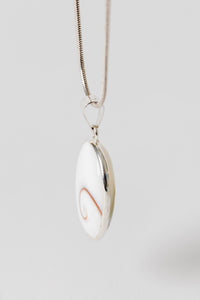 Sterling Shiva eye pendant with natural shell spiral pattern
