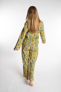 Sophie is wearing the yellow floral Morning Glory Jaipur Printed Pajama Set in S/M
