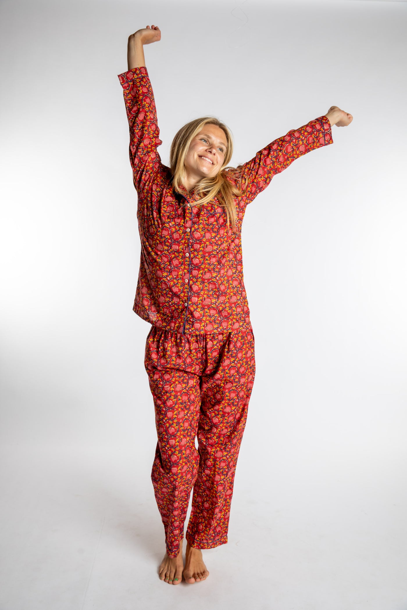 Sophie is wearing the red floral Pomegranate Jaipur Printed Pajama Set in S/M