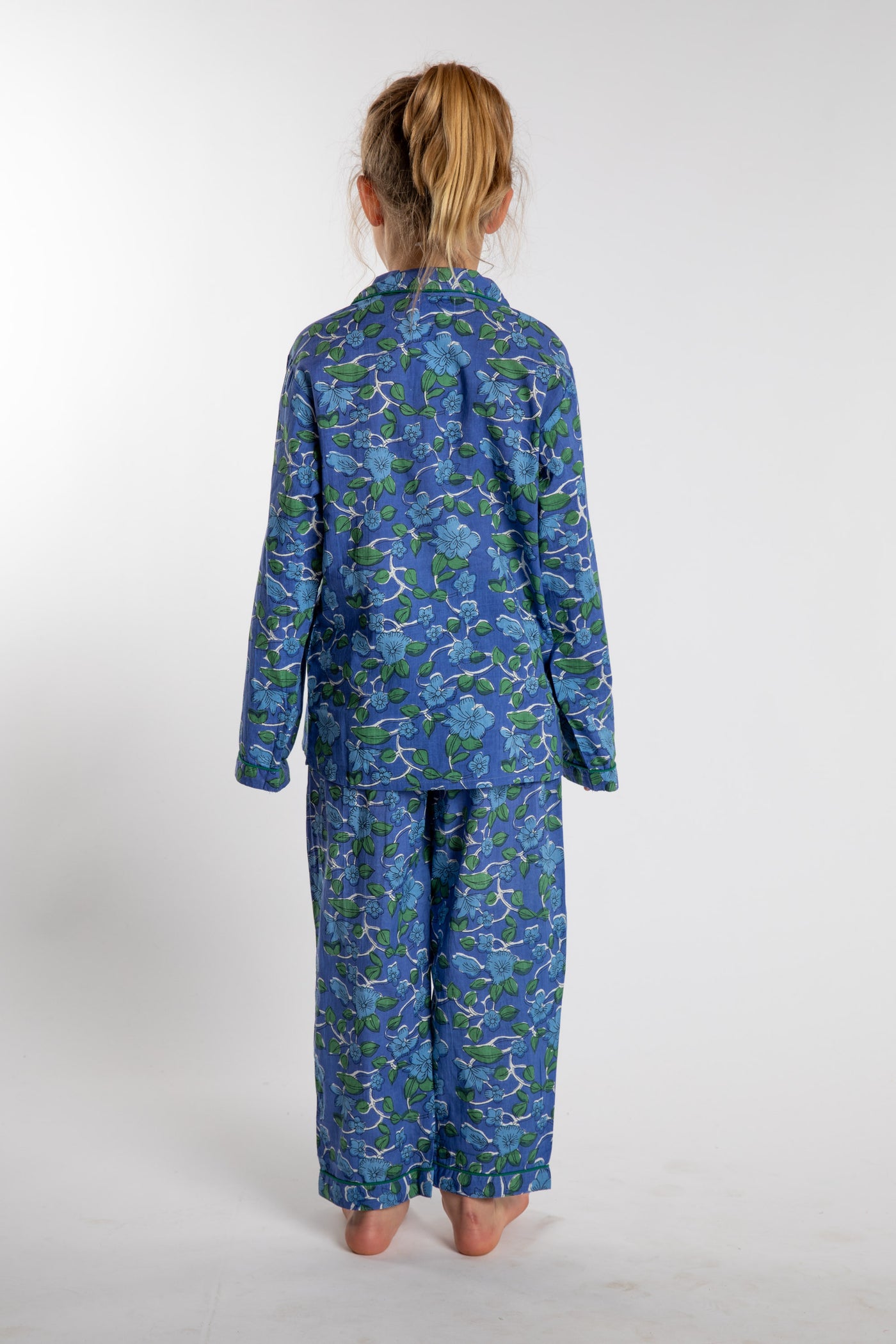 Louisa, age 7, wearing the size 4/5 Kids Jaipur Printed Pajama Set in Blue Blooms