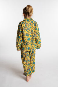 Louisa, age 7, wearing the size 4/5 Kids Jaipur Printed Pajama Set in Yellow Floral Morning Glory