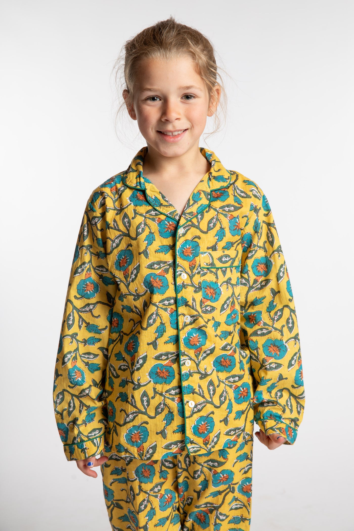 Louisa, age 7, wearing the size 4/5 Kids Jaipur Printed Pajama Set in Yellow Floral Morning Glory