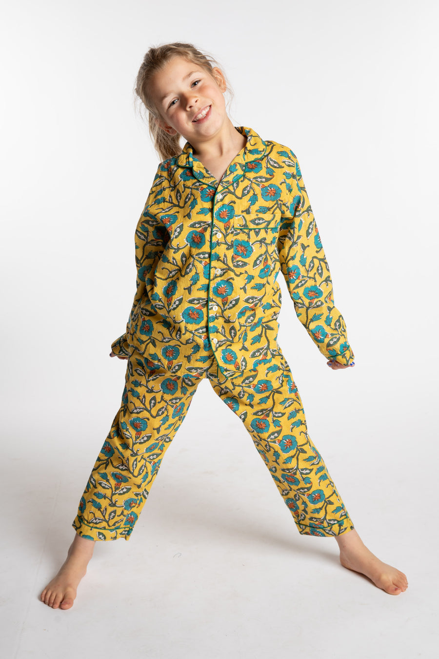 Louisa, age 7, wearing the size 4/5 Kids Jaipur Printed Pajama Set in Yellow Floral Morning Glory