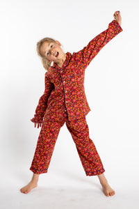 Louisa, age 7, wearing the size 4/5 Kids Jaipur Printed Pajama Set in Red Floral Pomegranate.