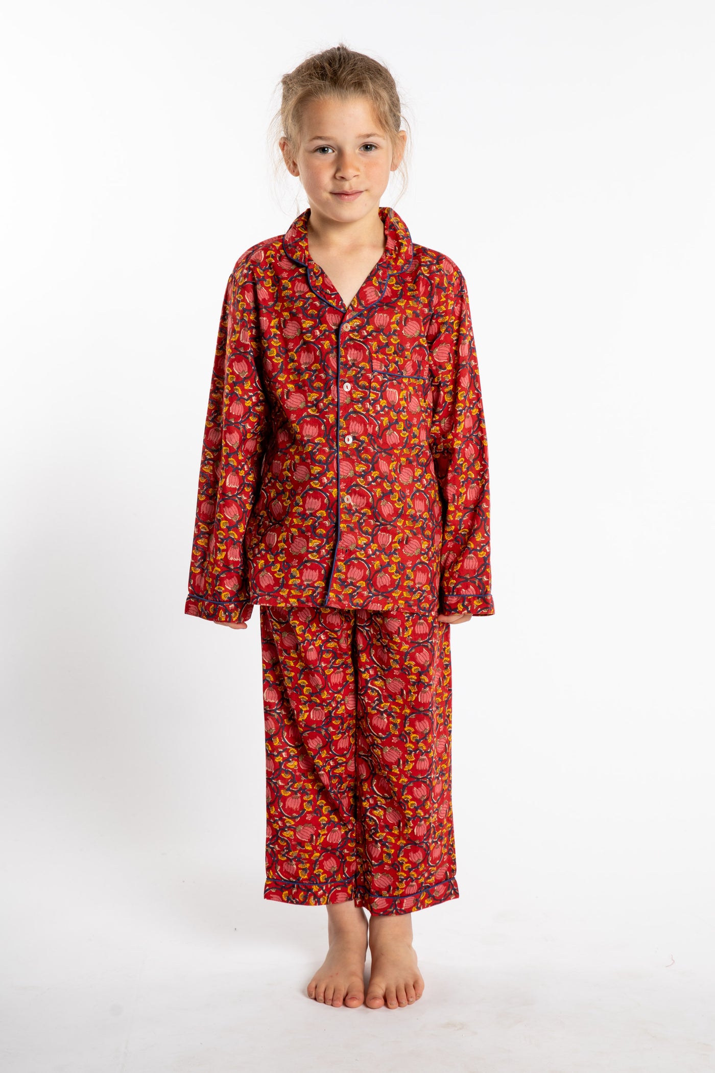 Louisa, age 7, wearing the size 4/5 Kids Jaipur Printed Pajama Set in Red Floral Pomegranate.