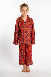 Louisa, age 7, wearing the size 4/5 Kids Jaipur Printed Pajama Set in Red Floral Pomegranate.