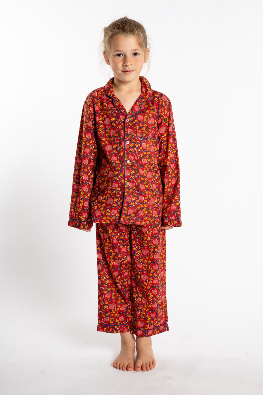 Louisa, age 7, wearing the size 4/5 Kids Jaipur Printed Pajama Set in Red Floral Pomegranate.