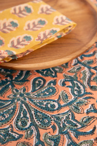 Dusty Coral floral block print placemat under teak plate and block print napkin 