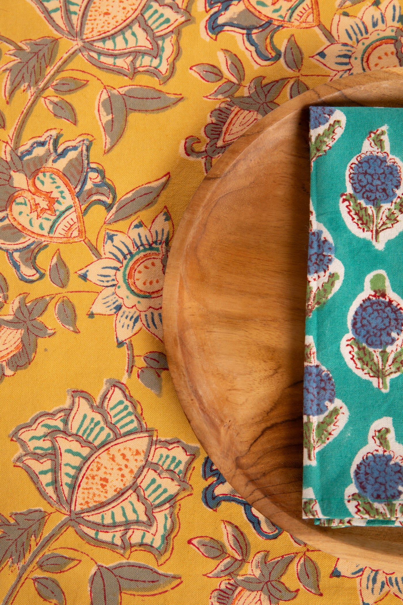 Marigold Yellow floral block print placemat under teak plate and block print napkin 