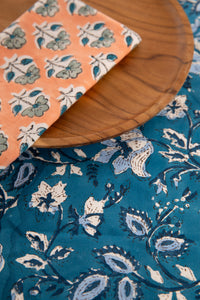 Storm Blue floral block print placemat under teak plate and block print napkin 
