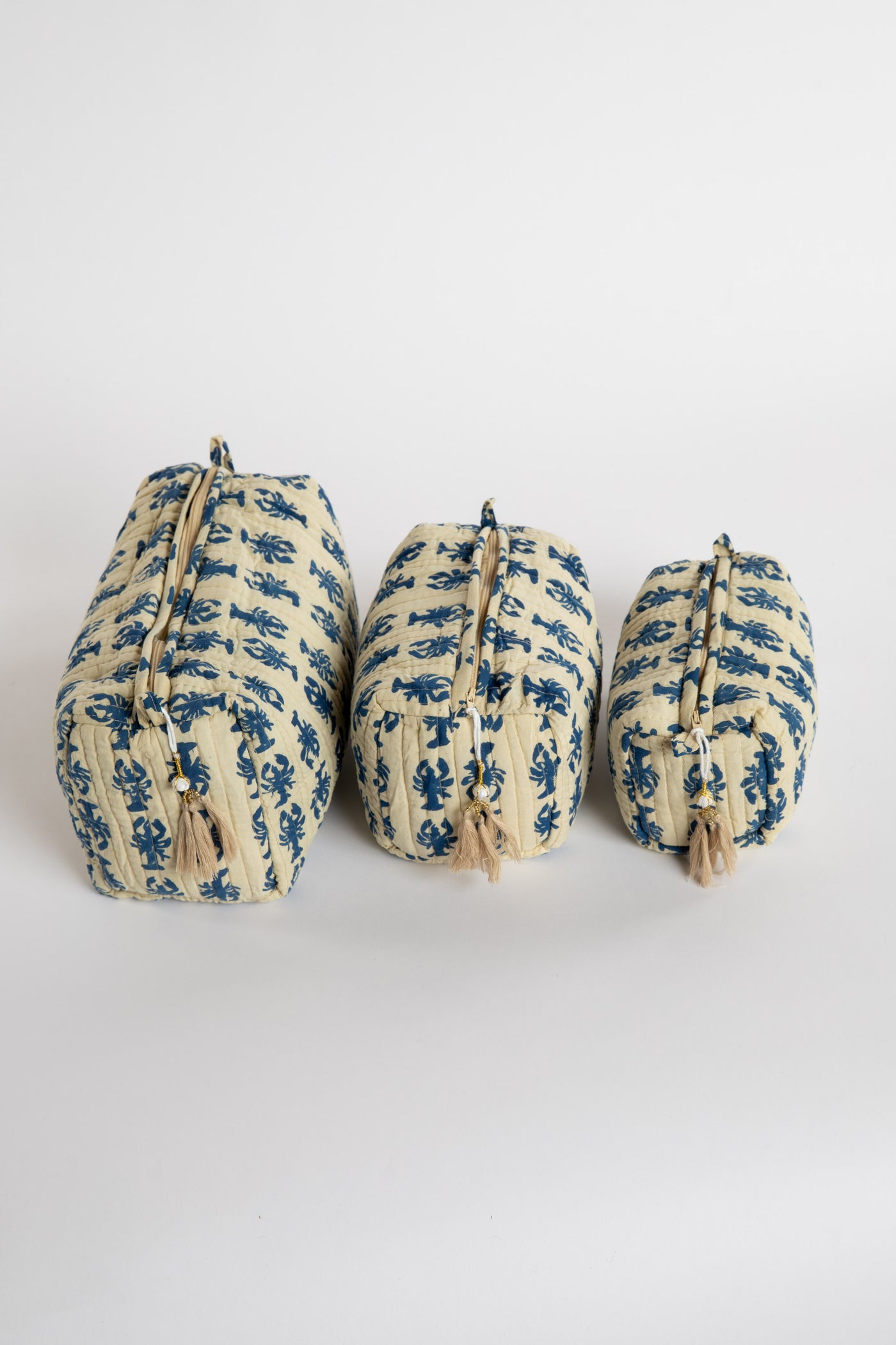Quilted block print bag in blue lobster. Available in 3 sizes.