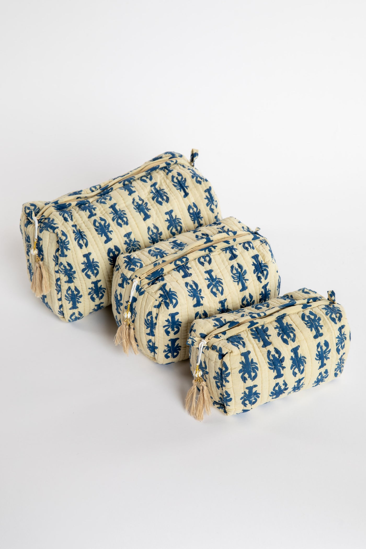Quilted block print bag in blue lobster. Available in 3 sizes.