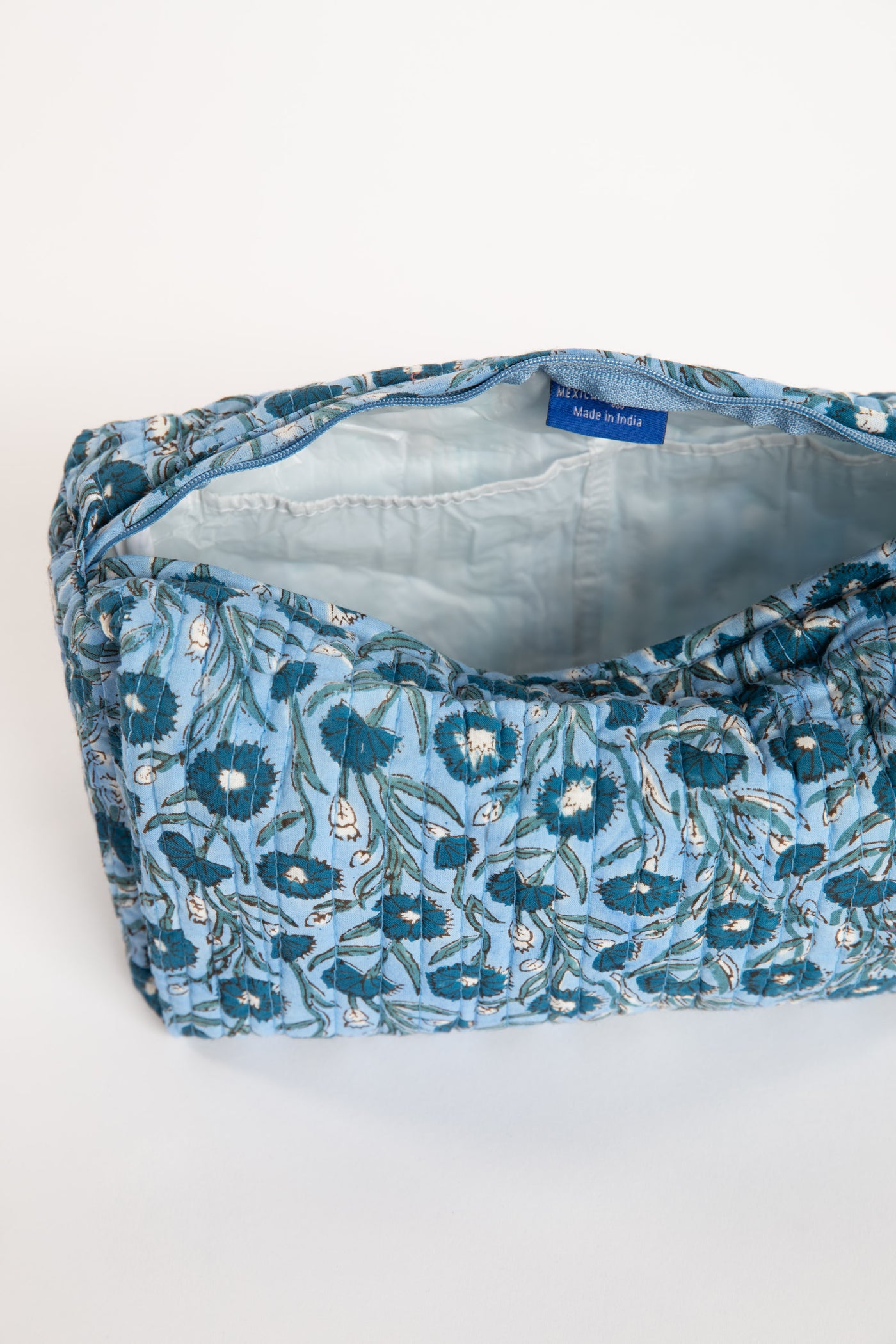 Quilted block print bag in blue mist floral. Available in 3 sizes.