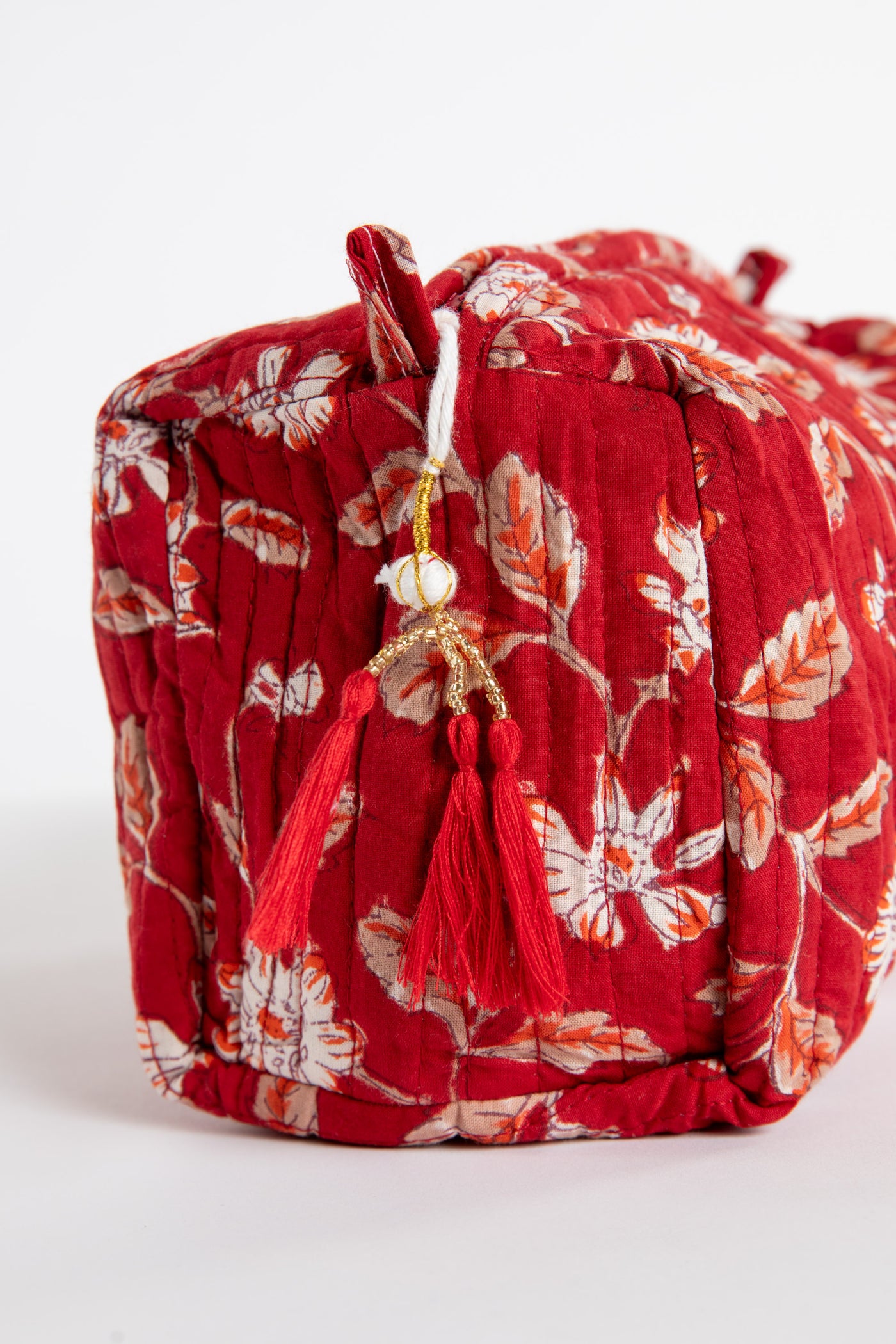 Quilted block print bag in red Garnet floral. Available in 3 sizes.
