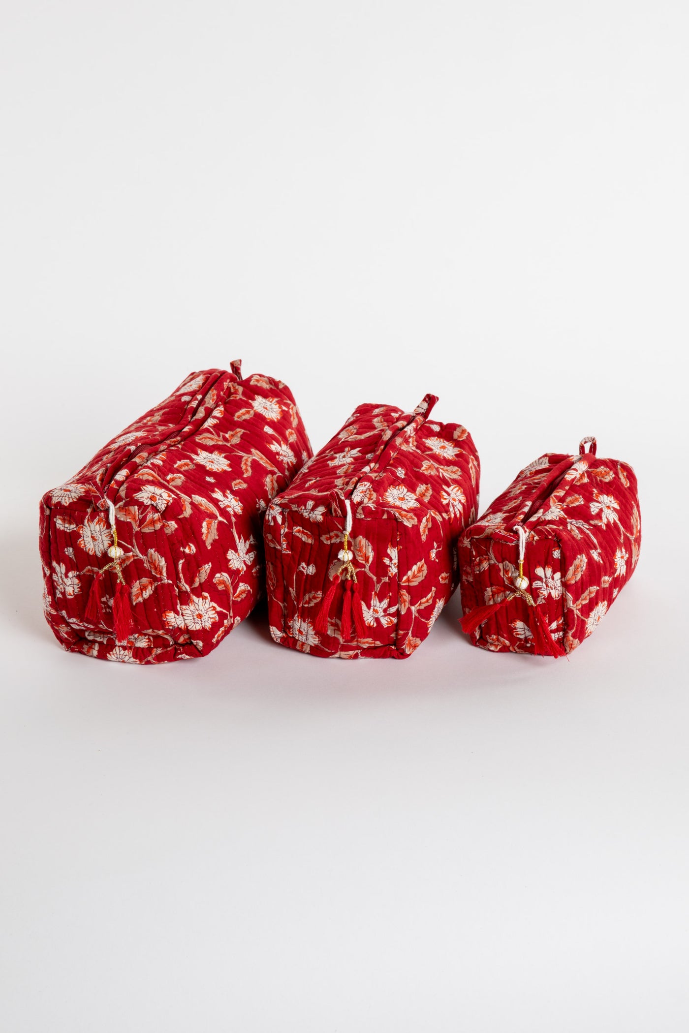 Quilted block print bag in red Garnet floral. Available in 3 sizes.