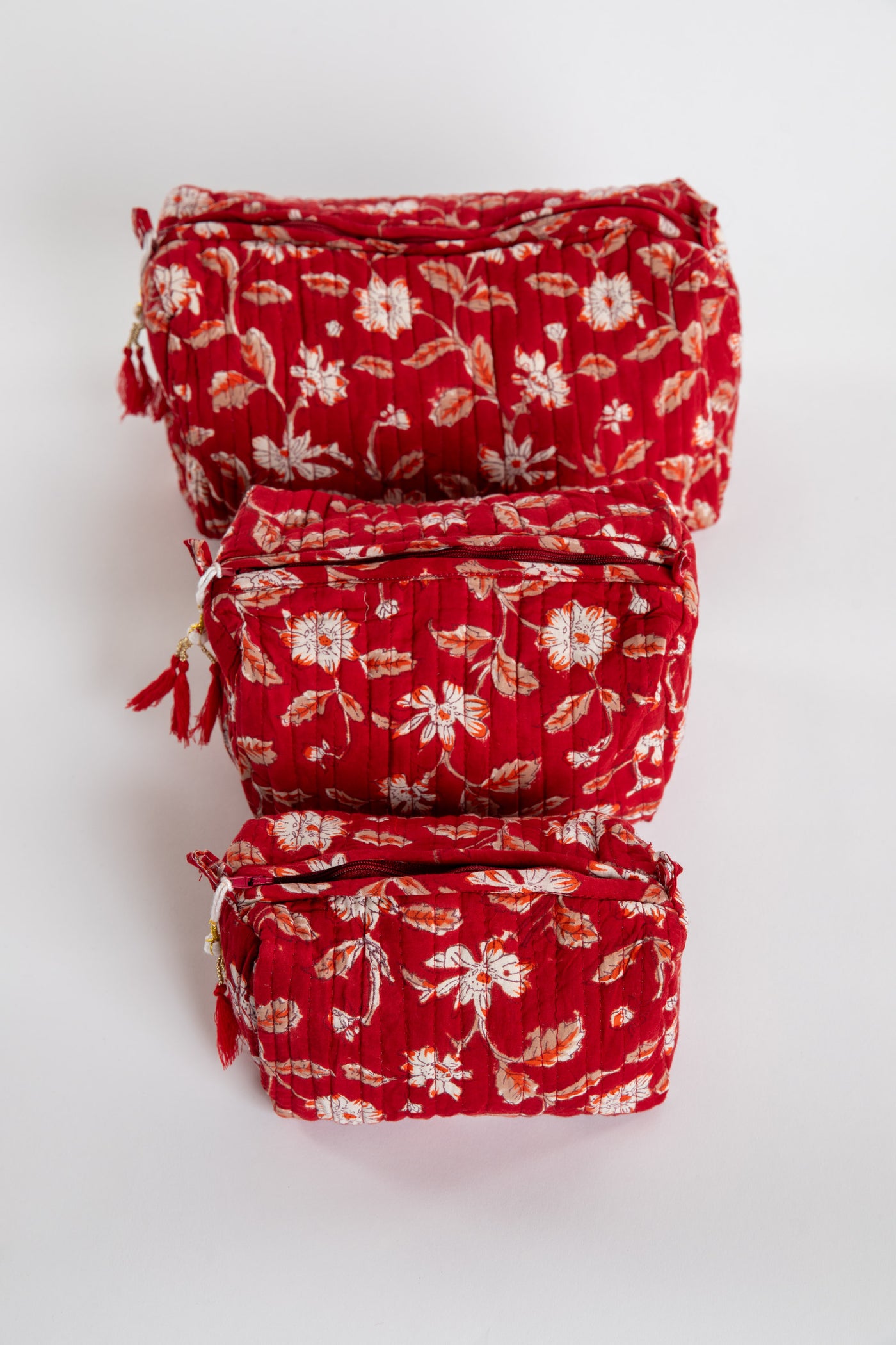 Quilted block print bag in red Garnet floral. Available in 3 sizes.