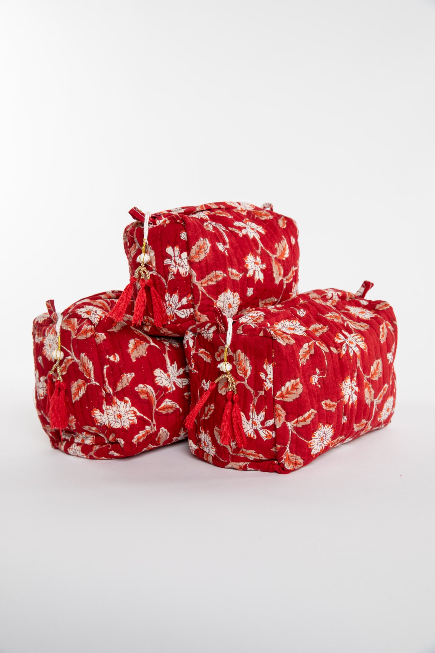 Quilted block print bag in red Garnet floral. Available in 3 sizes.