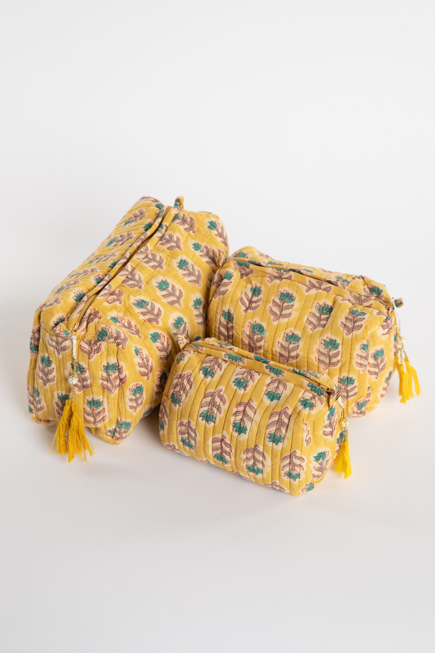 Quilted block print bag in yellow Mustard floral. Available in 3 sizes.
