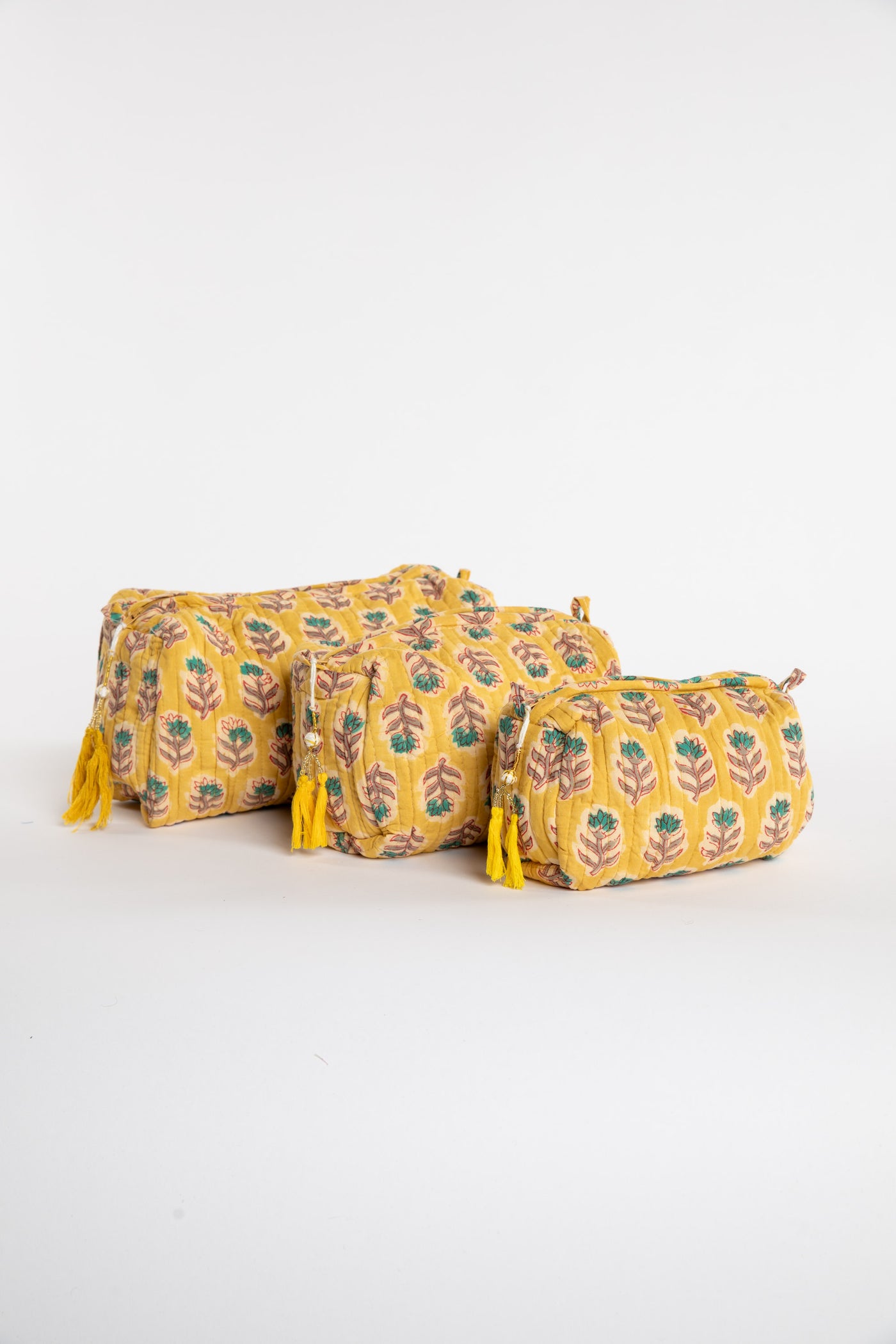 Quilted block print bag in yellow Mustard floral. Available in 3 sizes.