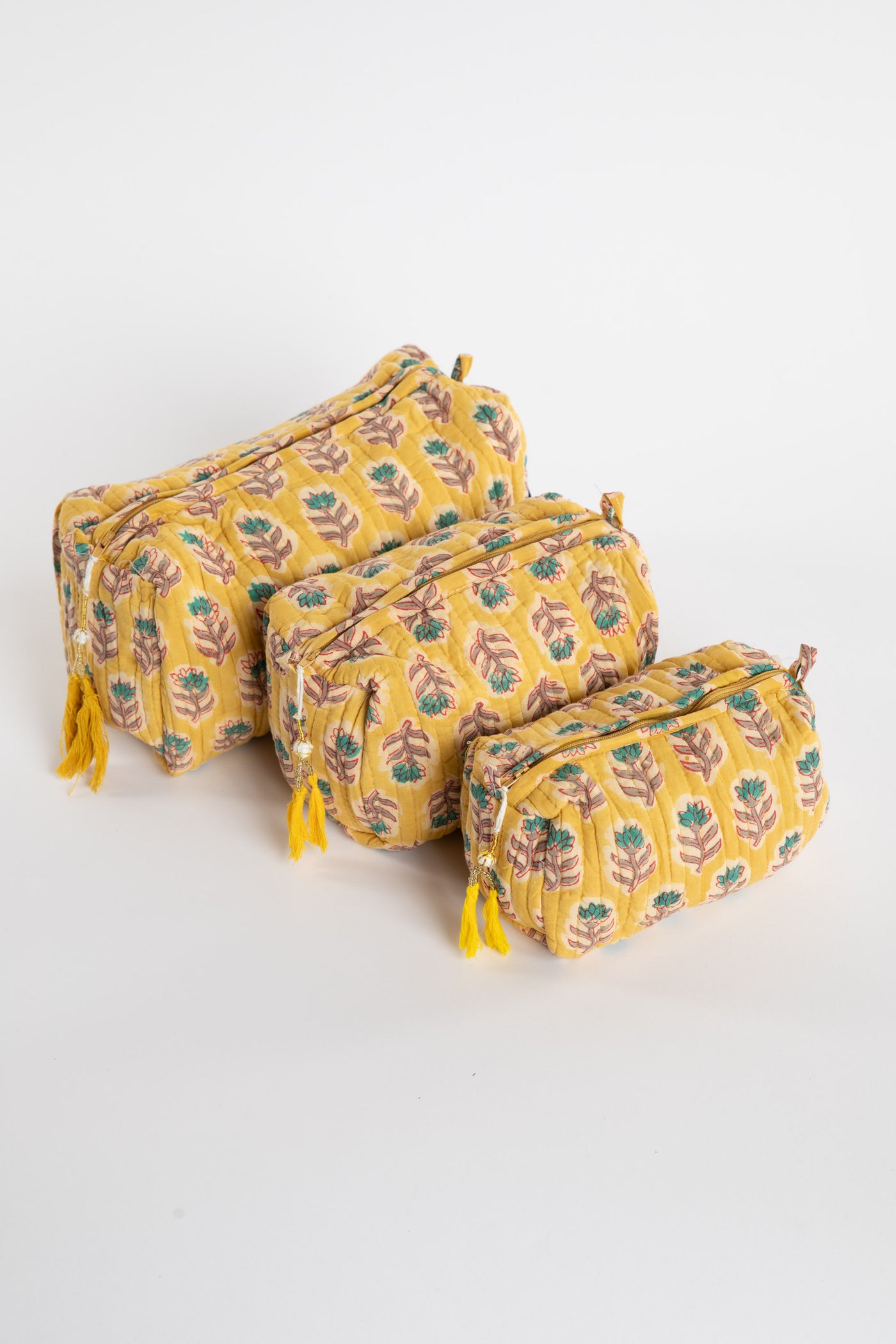 Quilted block print bag in yellow Mustard floral. Available in 3 sizes.