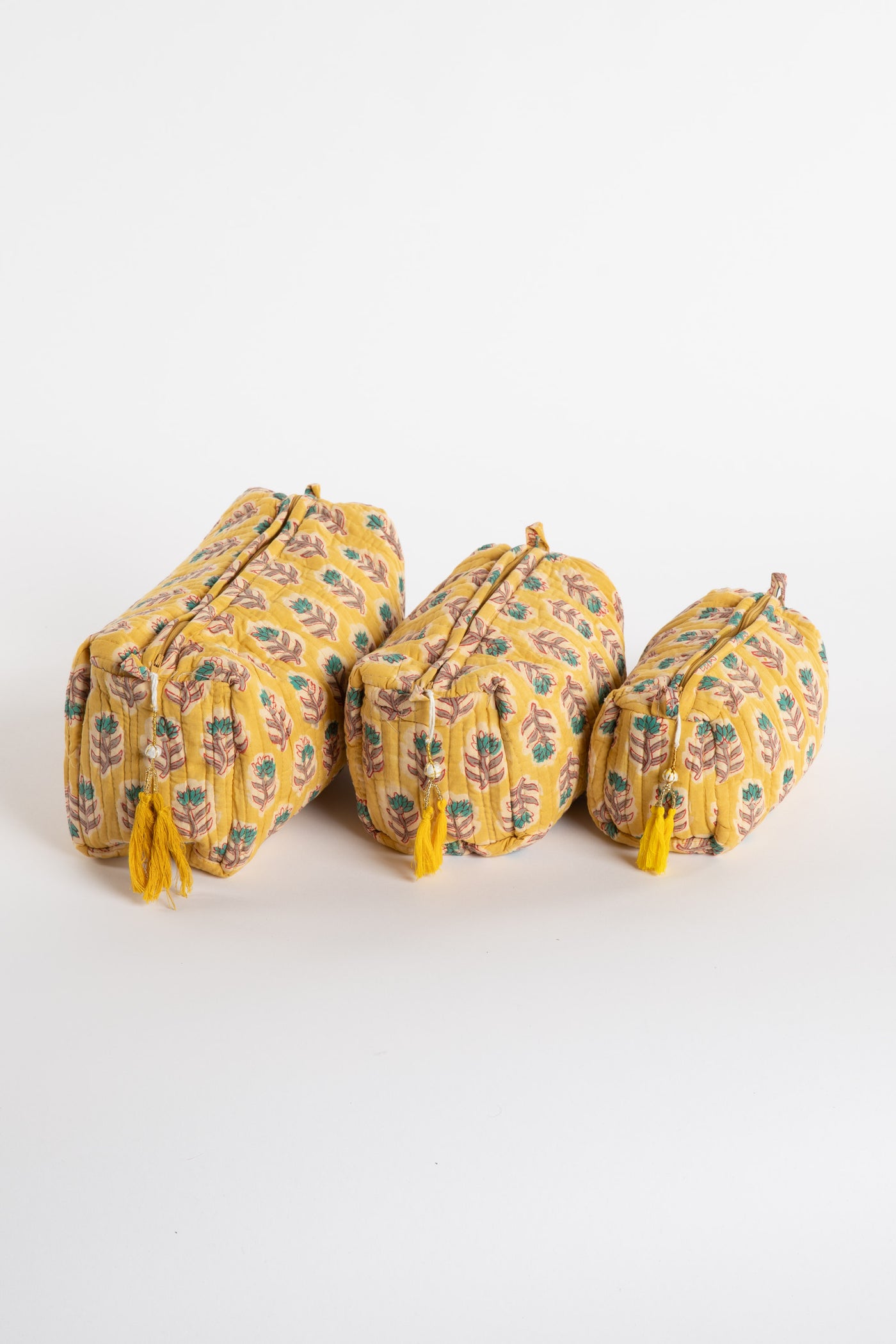 Quilted block print bag in yellow Mustard floral. Available in 3 sizes.