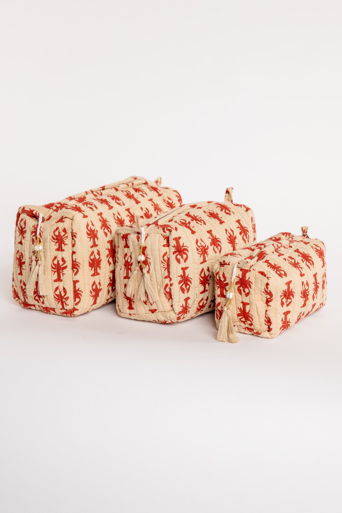 Quilted block print bag in red lobster. Available in 3 sizes.