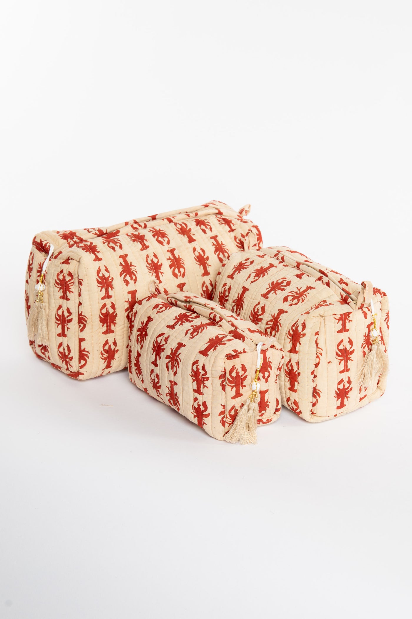 Quilted block print bag in red lobster. Available in 3 sizes.