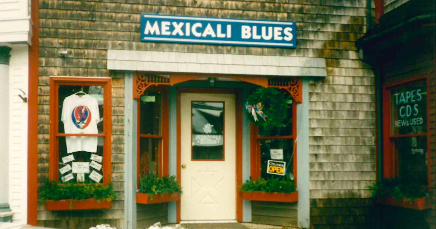 An original Mexicali Blues storefront with a Grateful Dead stealie tee in the window