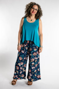 Susan is wearing the one size Ahana Flow Tank in Azure and Printed Penny Lane Pants in M/L in Blue Blooms