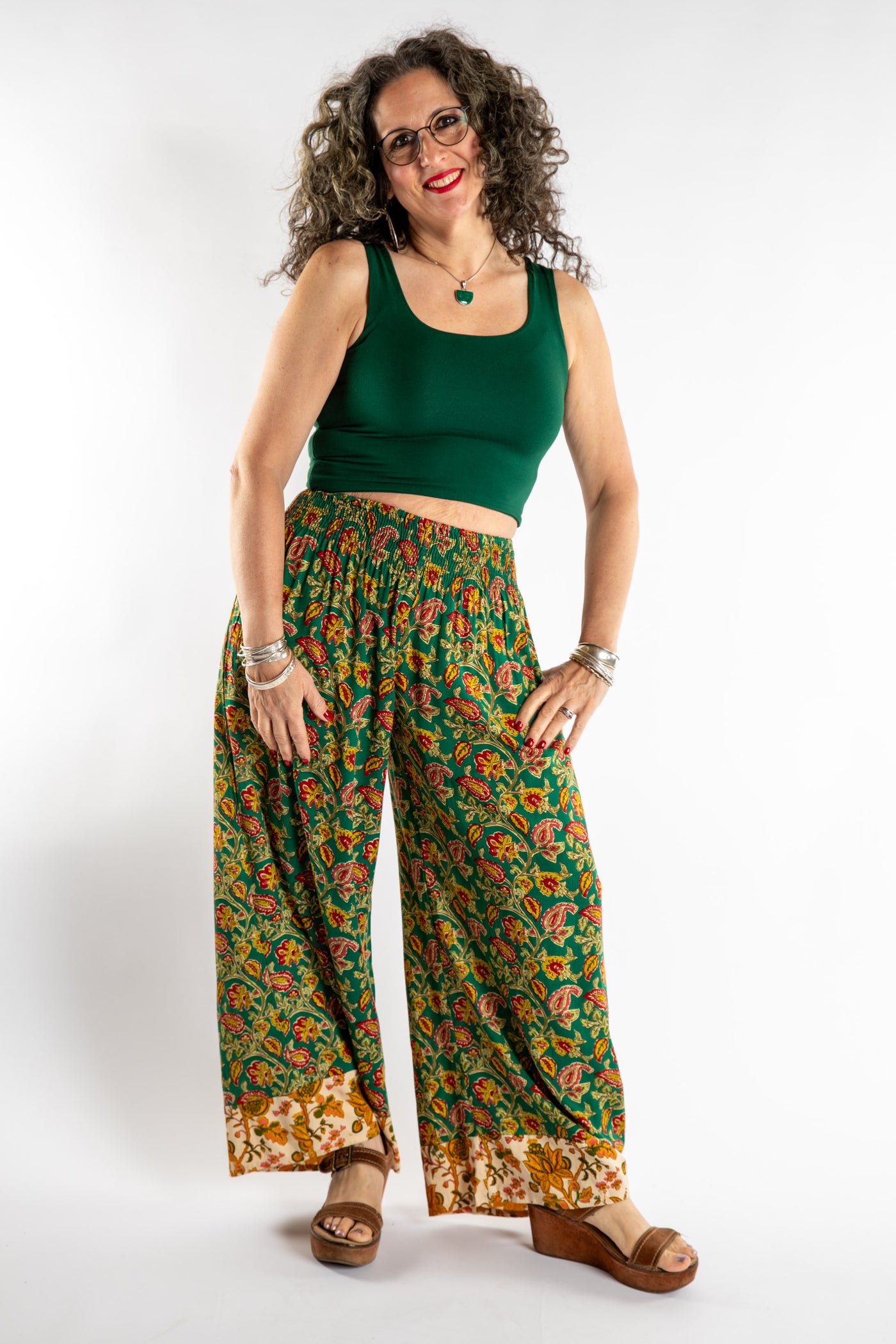 Susan is wearing the Forest Green Penny Lane Contrast Pants in M/L and the Sunanda Stretchy Tank in M/L
