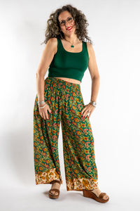 Susan is wearing the Forest Green Penny Lane Contrast Pants in M/L and the Sunanda Stretchy Tank in M/L
