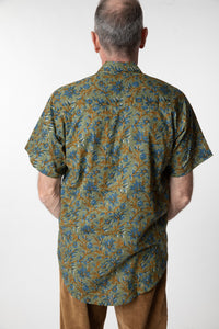 Chris, 5'7", wearing the LaLa Printed Cotton Button Up in Sage Floral, size M