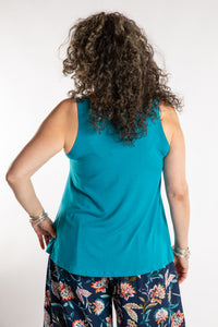 Susan is wearing the Ahana Flow Tank in Azure