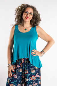 Susan is wearing the Ahana Flow Tank in Azure
