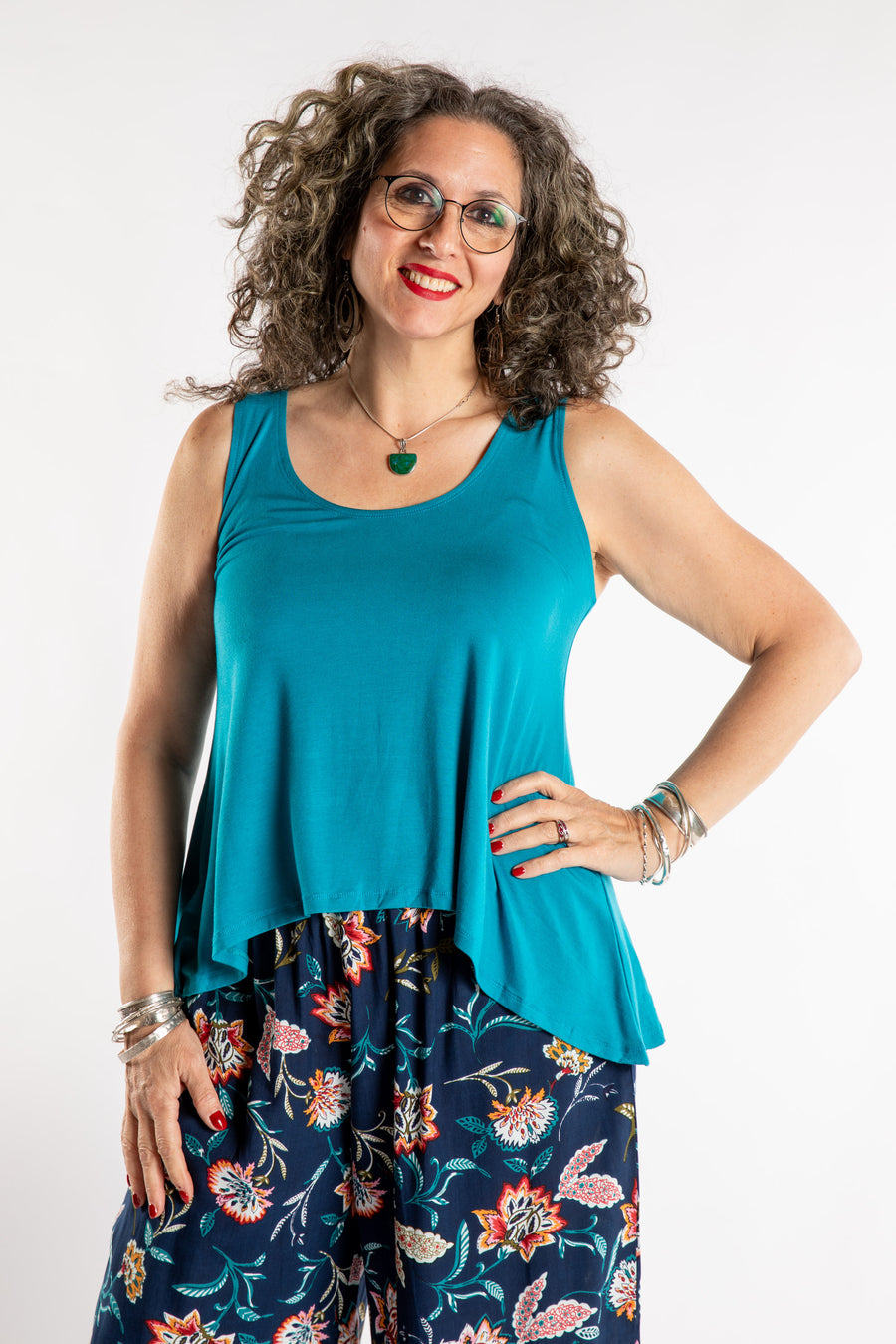 Susan is wearing the Ahana Flow Tank in Azure