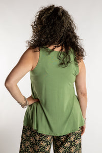 Susan is wearing the Ahana Flow Tank in Light Green