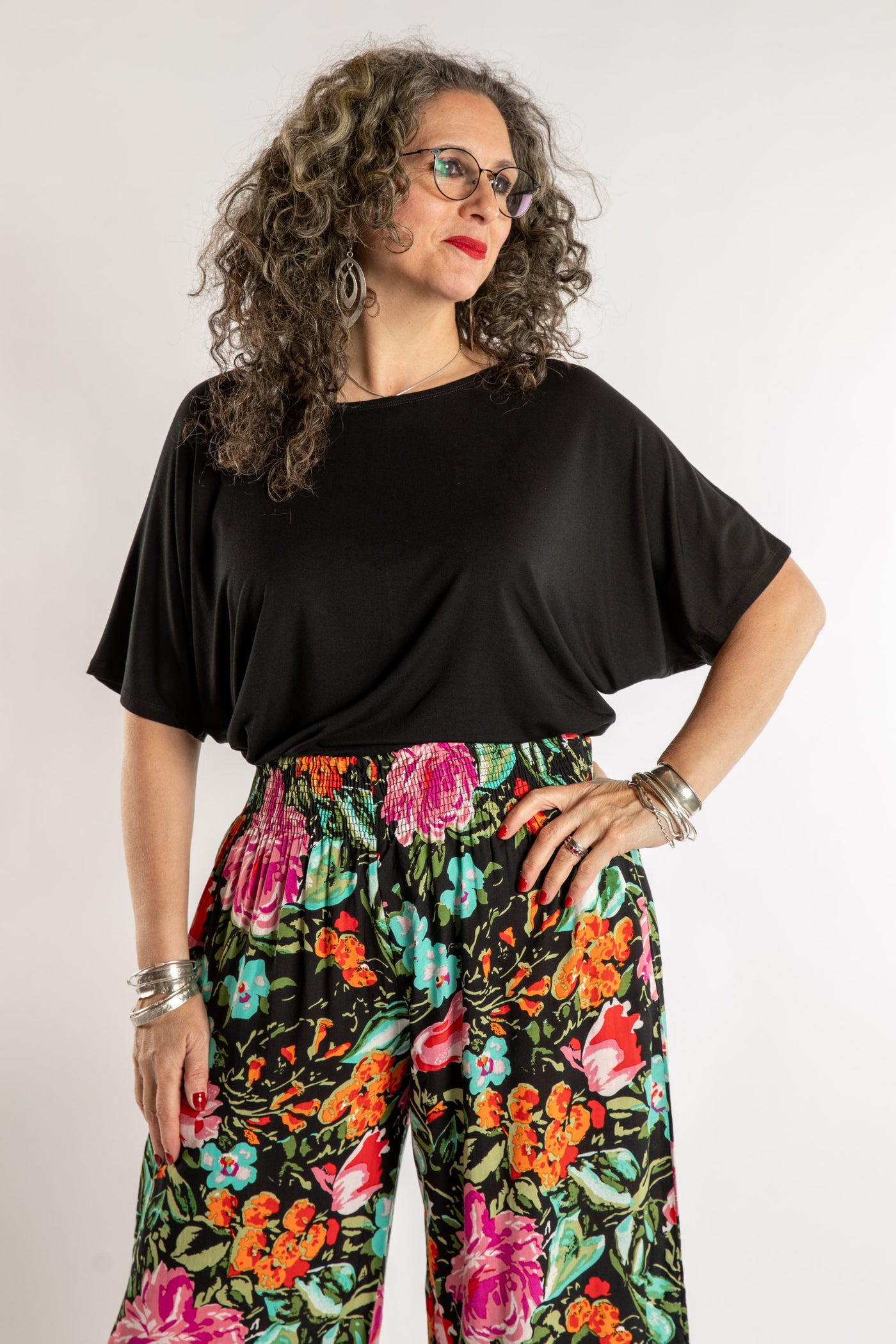 Susan is wearing the Allie Dolman in Black in L/XL