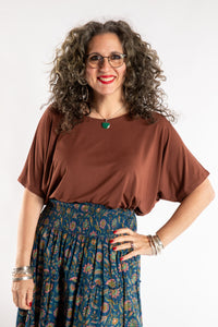 Susan is wearing the Allie Dolman in Brown in L/XL