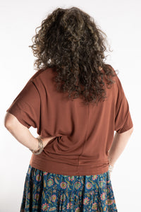 Susan is wearing the Allie Dolman in Brown in L/XL