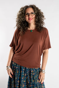 Susan is wearing the Allie Dolman in Brown in L/XL
