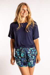 Sophie is wearing size S/M top in Blue Harbor with floral shorts