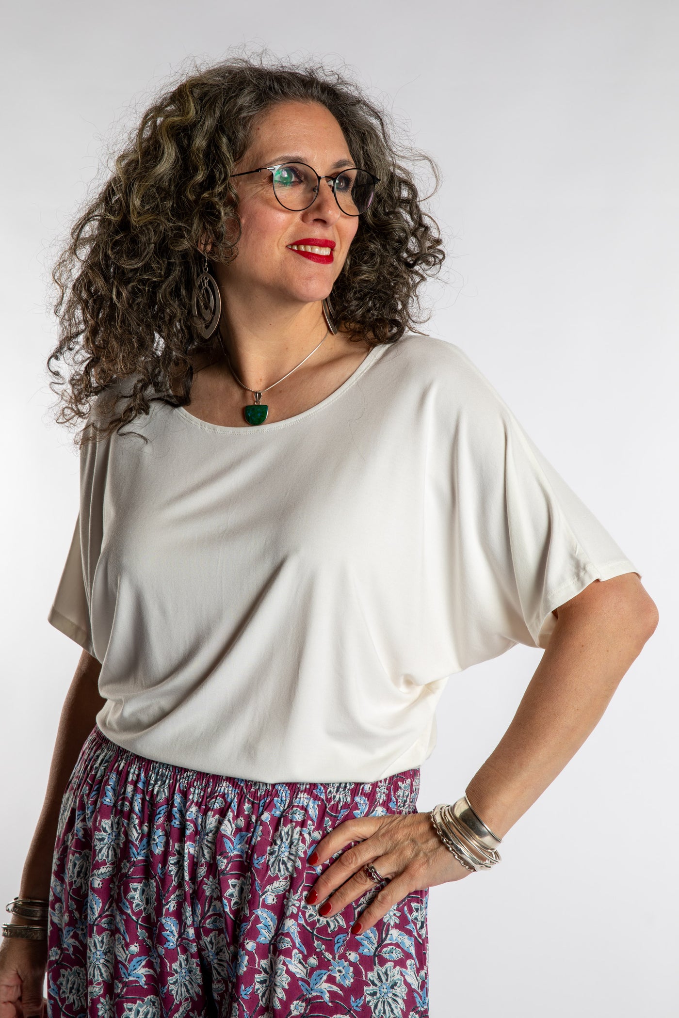 Susan is wearing the Allie Dolman in White in L/XL