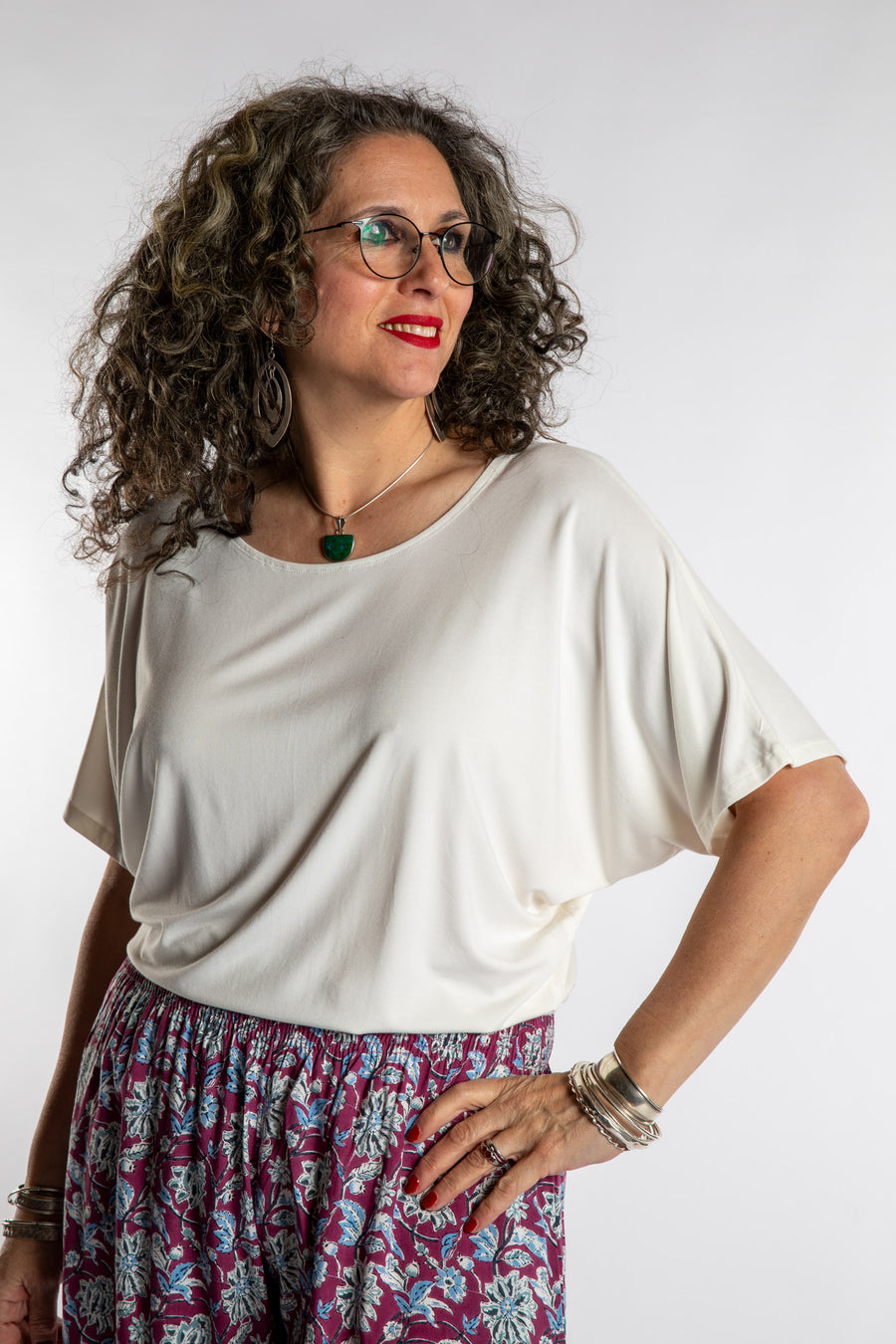 Susan is wearing the Allie Dolman in White in L/XL