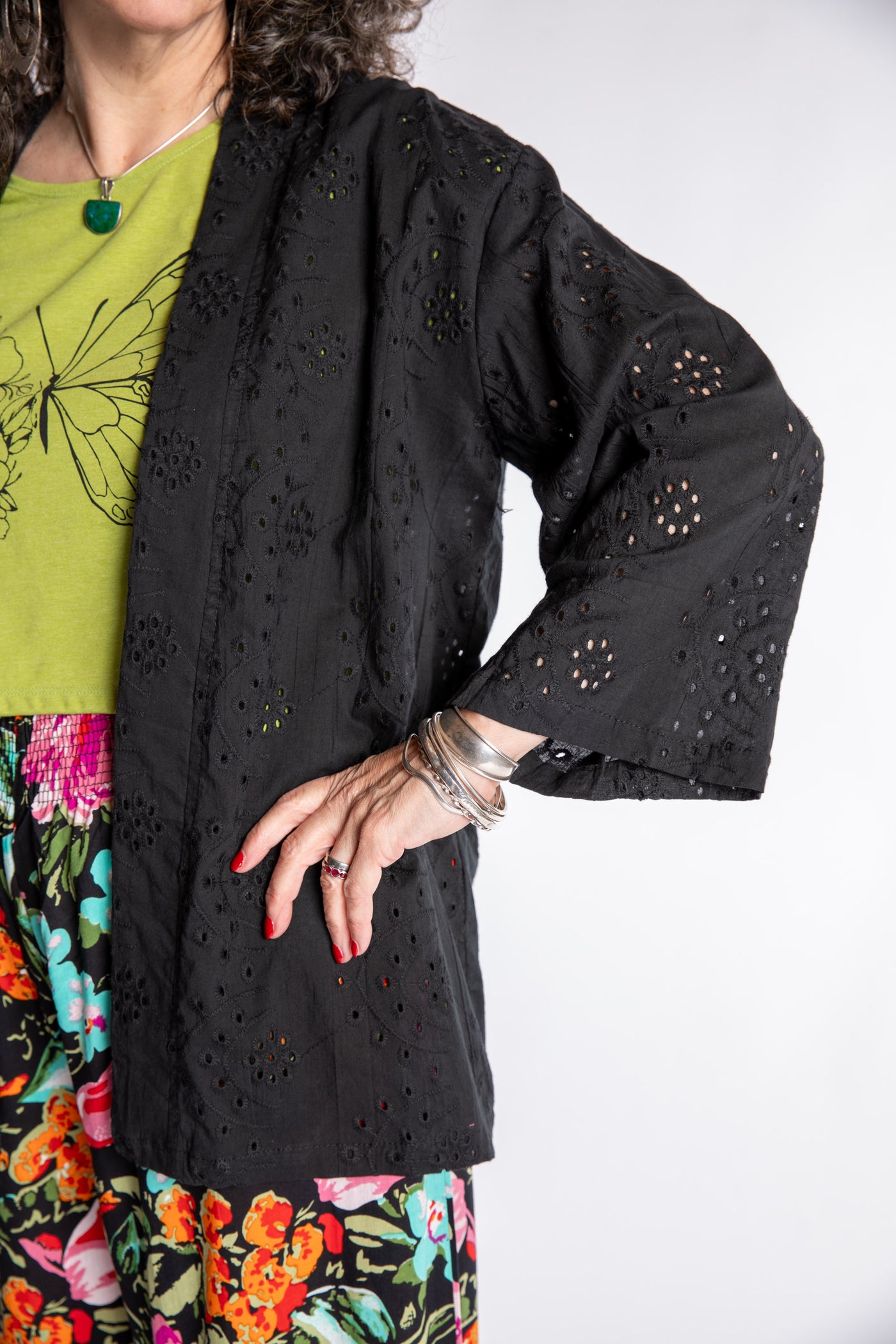 Susan is wearing the one size Anandi cardigan in Black