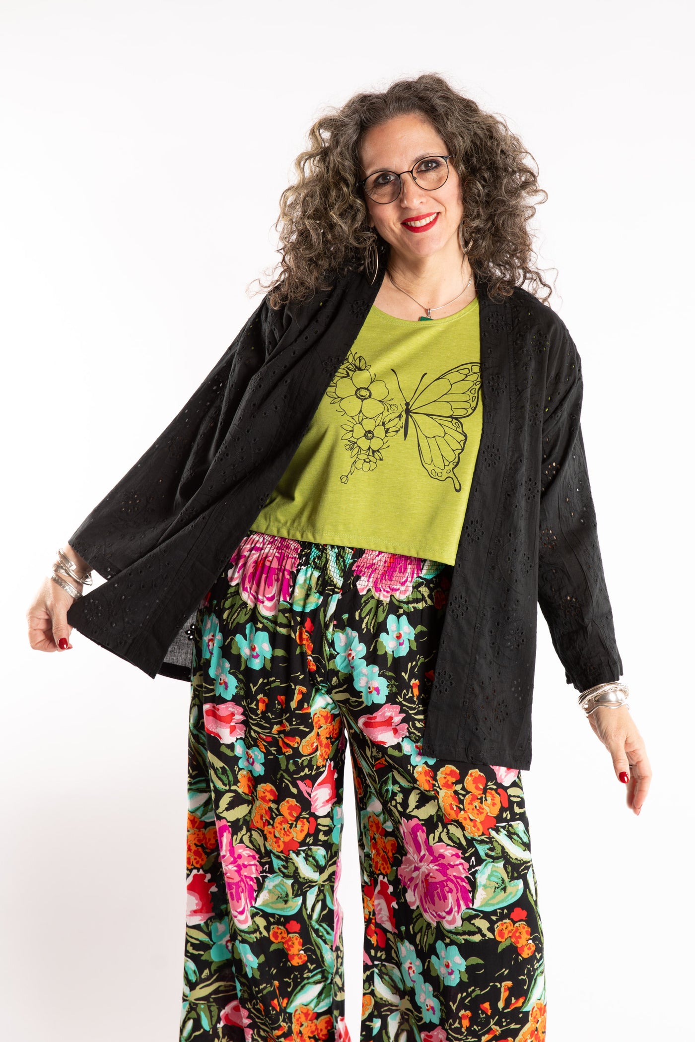 Susan is wearing the one size Anandi cardigan in Black