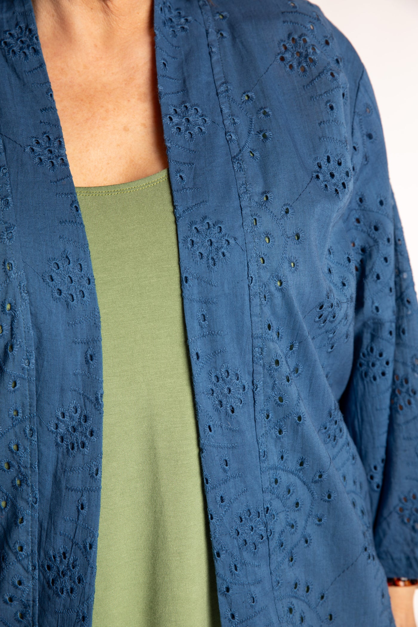 Betty is wearing the one size Anandi cardigan in Blue