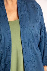 Betty is wearing the one size Anandi cardigan in Blue