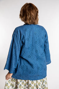 Betty is wearing the one size Anandi cardigan in Blue